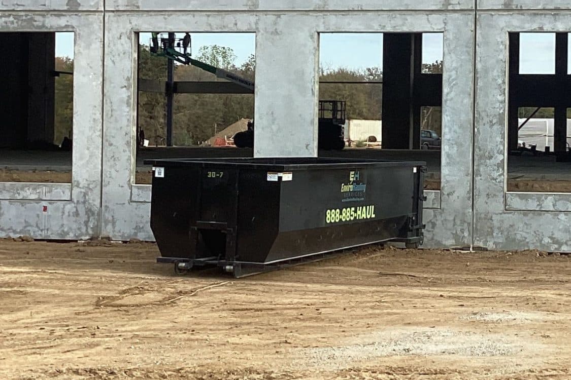 EnviroHauling roll-off container on a commercial construction site