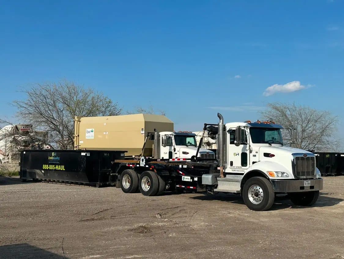 EnviroHauling roll-off trucks and containers in the yard