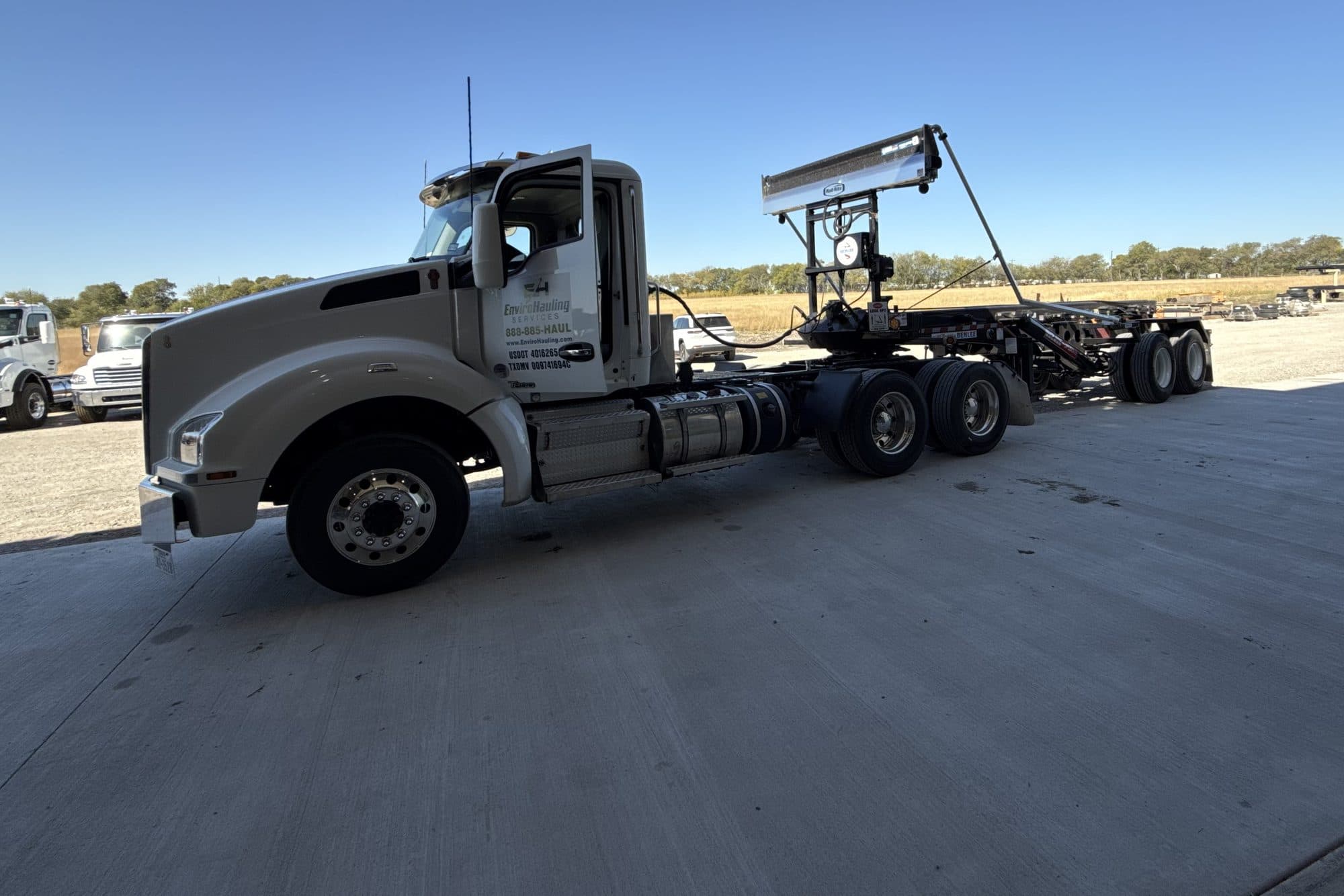EnviroHauling roll-off truck parked on a concrete pad